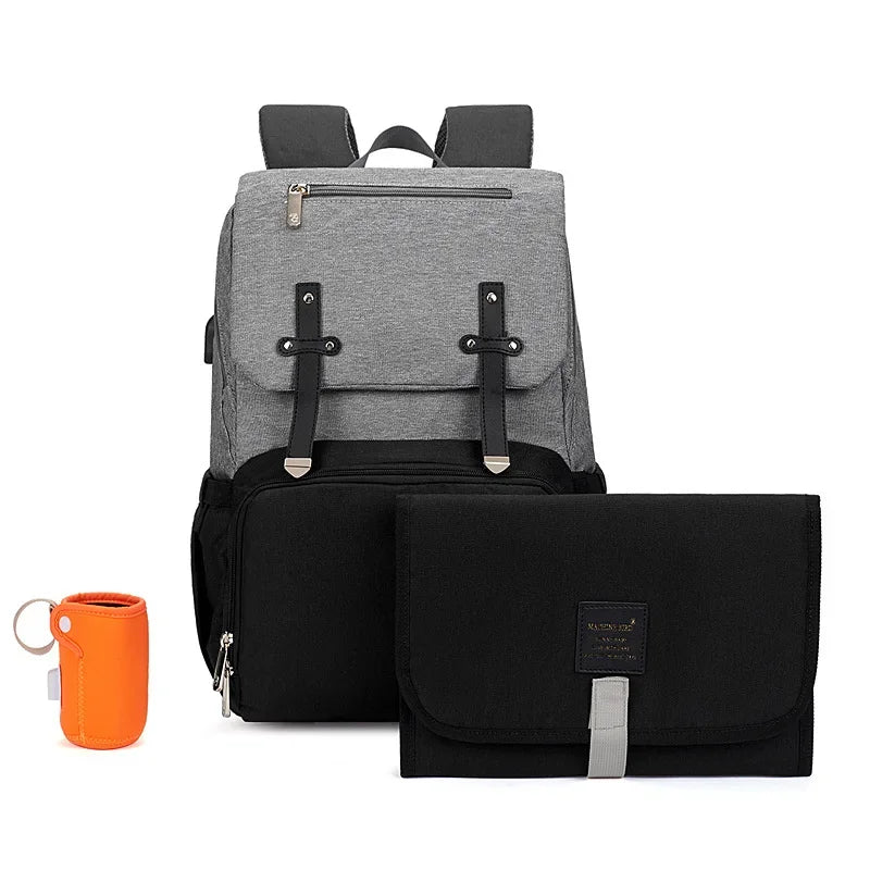 Nova Mart denim baby diaper bag backpack with thermal bottle pocket, featuring a spacious design and adjustable straps.
