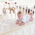 Wooden baby crib mobile with felt animal dolls and musical chime, designed as a baby toy by Nova Mart.