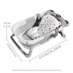 Collapsible baby bathtub with built-in thermometer and floating cushion, designed for safe and comfortable infant bathing by Nova Mart.