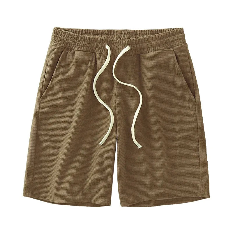 Men's waffle texture casual shorts by Nova Mart with a loose fit and drawstring waist, perfect for summer wear.