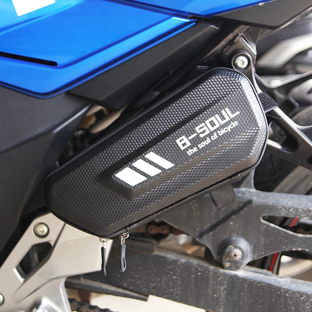 Nova Mart scooter hanging side package bag with EVA hard shell for motorcycle frame storage, shown attached to a motorcycle.