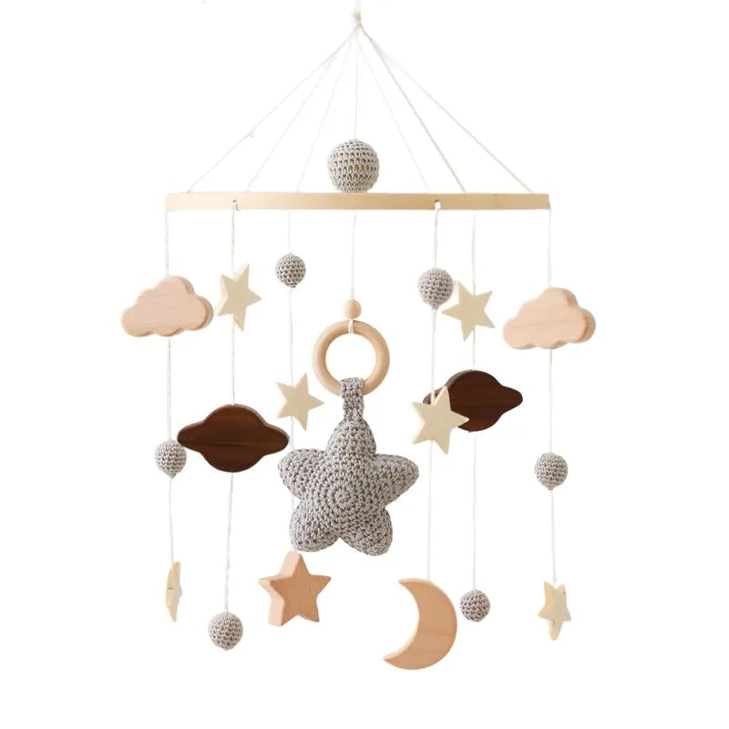 Wooden crochet stars baby crib mobile with bell and rattle toy by Nova Mart, featuring soft star-shaped crochet decorations.