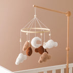 Wooden crochet star baby crib mobile with bell rattle toy from Nova Mart, featuring soft crochet stars hanging on a wooden frame.