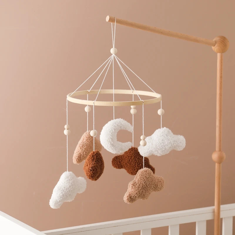 Wooden crochet star baby crib mobile with bell rattle toy from Nova Mart, featuring soft crochet stars hanging on a wooden frame.
