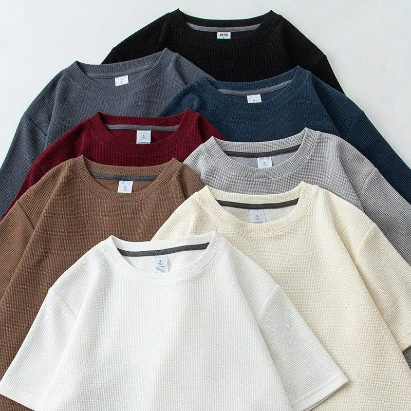 Unisex waffle knit T-shirt in solid color by Nova Mart, casual loose fit men's fashion, soft textured fabric.