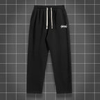 Men's solid color straight leg jogging pants by Nova Mart, casual sportswear, shown in a relaxed fit with a focus on fabric and design.