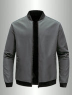 Men's loose solid color jacket with baseball collar by Nova Mart, front view showing casual fit and simple design.