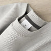 Unisex waffle knit T-shirt in solid color, casual men's fashion by Nova Mart, featuring a loose, comfortable fit.