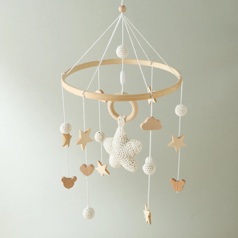 Wooden crochet star baby crib mobile with bell and rattle, Nova Mart baby toy for soothing and entertainment.