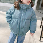Kids thick padded winter coat by Nova Mart, boys and girls warm parka with hood and quilted design, suitable for cold weather.