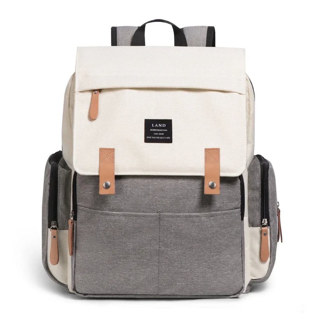 Nova Mart denim baby diaper bag backpack with thermal bottle pocket, featuring multiple compartments and adjustable straps.
