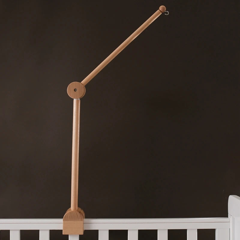 Baby wooden crib mobile by Nova Mart featuring cloud-shaped hanging rattle toy and bracket for easy attachment to crib.