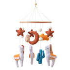 Wooden baby crib mobile featuring a soft felt cartoon bear and music box by Nova Mart, perfect for soothing infants in a nursery.