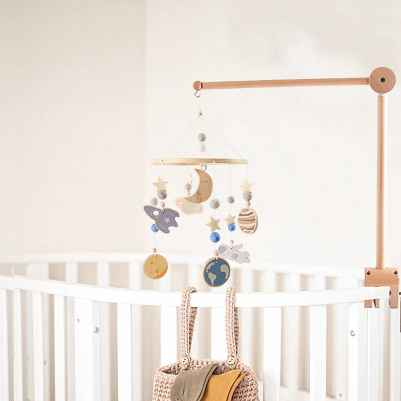 Baby wooden crib mobile by Nova Mart with cloud-shaped hanging rattle toy and bracket for crib decoration.