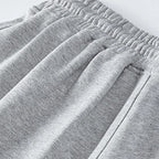 Men's casual drawstring jogger shorts by Nova Mart, showing comfortable black sweat shorts with elastic waistband and side pockets.