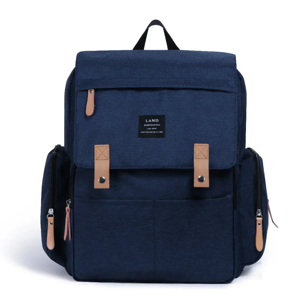 Nova Mart denim diaper bag backpack with thermal bottle pocket, spacious design, and adjustable straps for parents and babies.