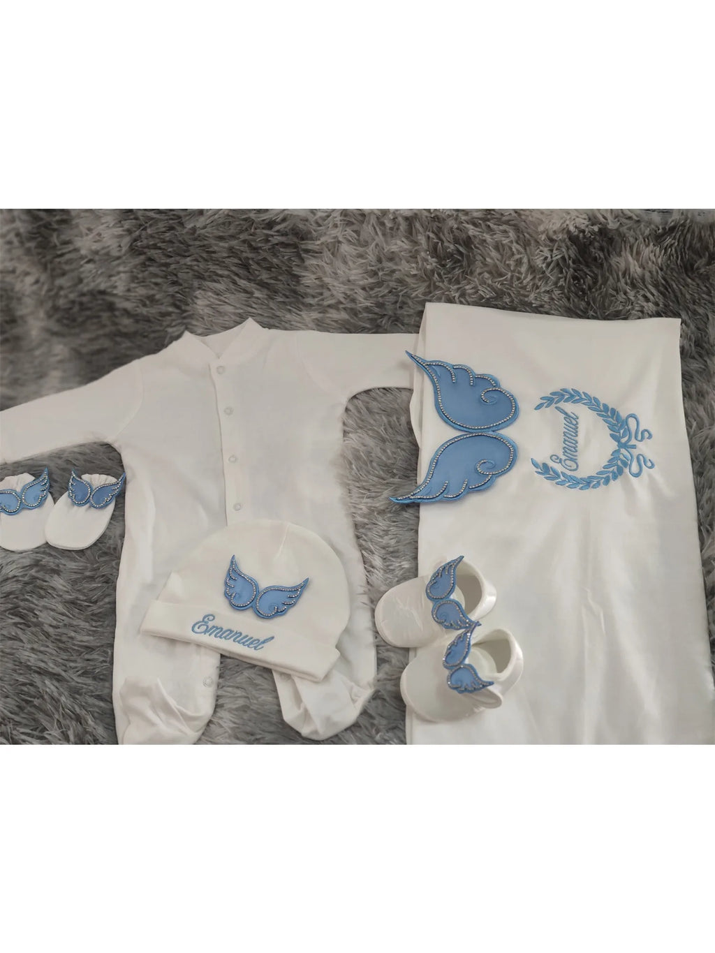 White and blue embroidered newborn angel wings outfit set from Nova Mart, featuring soft baby clothing and angel wing details.