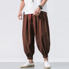 Men's oversize loose linen harem pants by Nova Mart, showing relaxed fit and lightweight fabric in natural linen color.