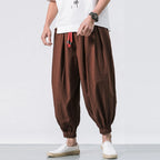 Men's oversize loose linen harem pants by Nova Mart, showing relaxed fit and lightweight fabric in natural linen color.