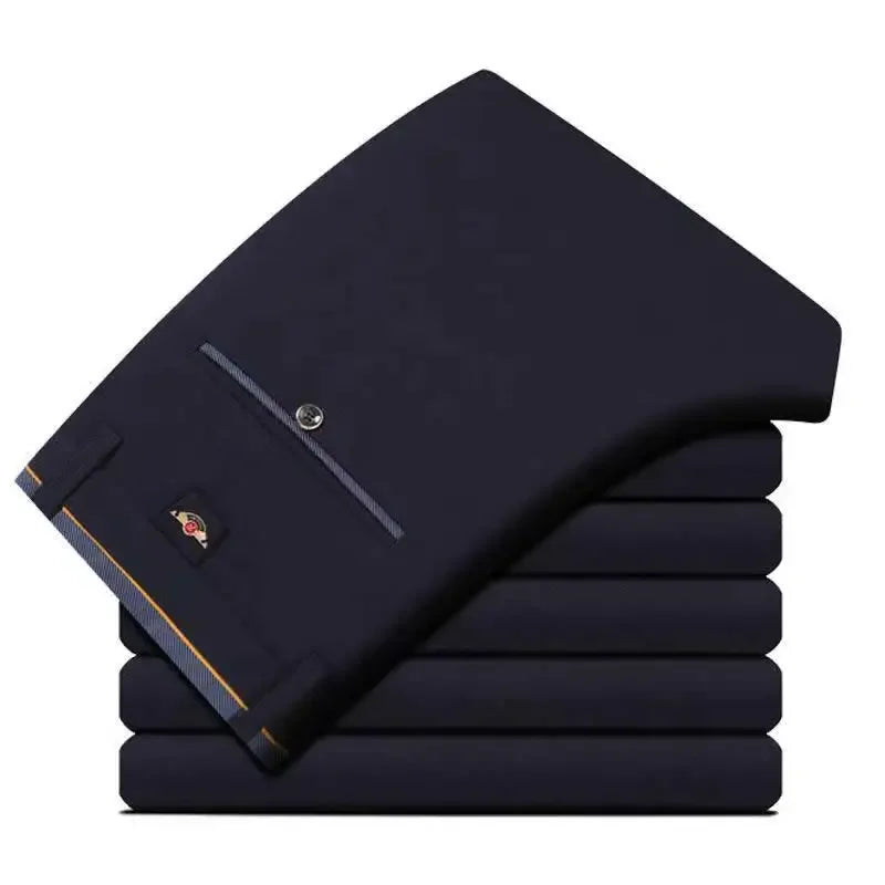 Men's slim fit black suit pants by Nova Mart, formal trousers with a tailored fit and classic style, shown on a model.