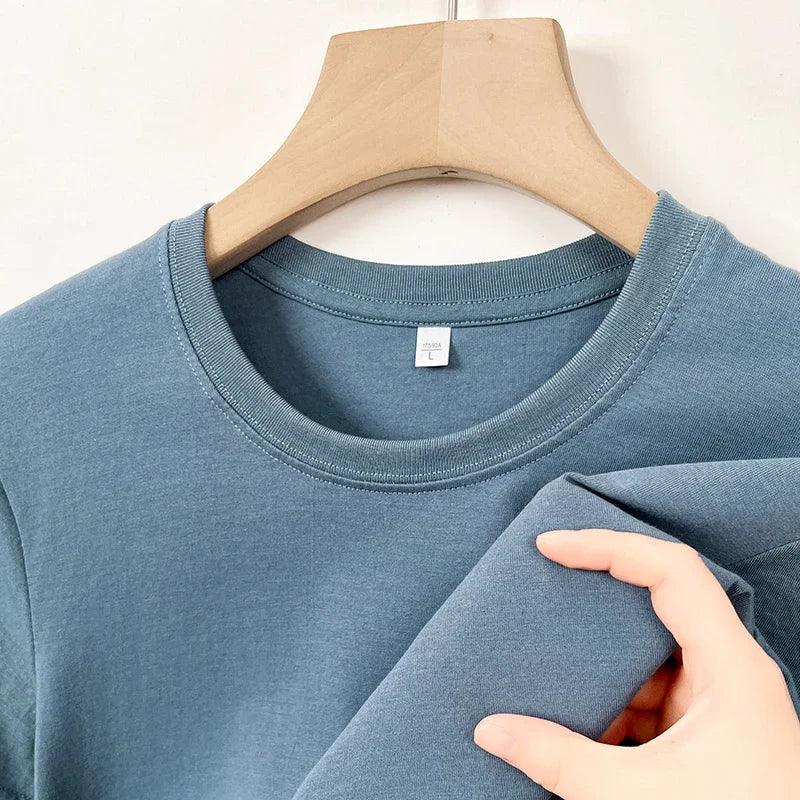 Men's Korean casual cotton round neck T-shirt by Nova Mart, shown in white with a simple, classic fit and soft fabric.