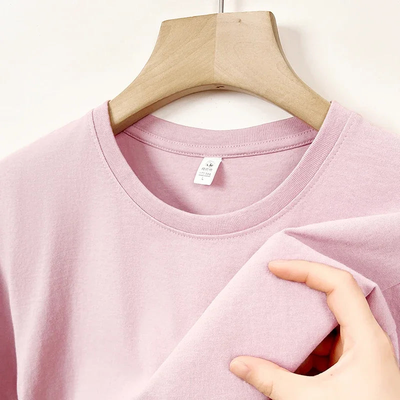 Men's Korean casual cotton round neck T-shirt by Nova Mart, plain white fabric, close-up of the soft, breathable material.