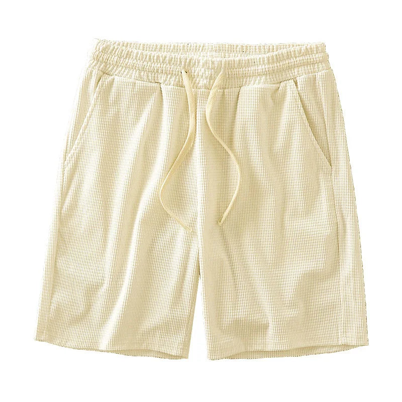 Men's navy waffle texture shorts with loose fit and drawstring waist, ideal for casual summer wear by Nova Mart.