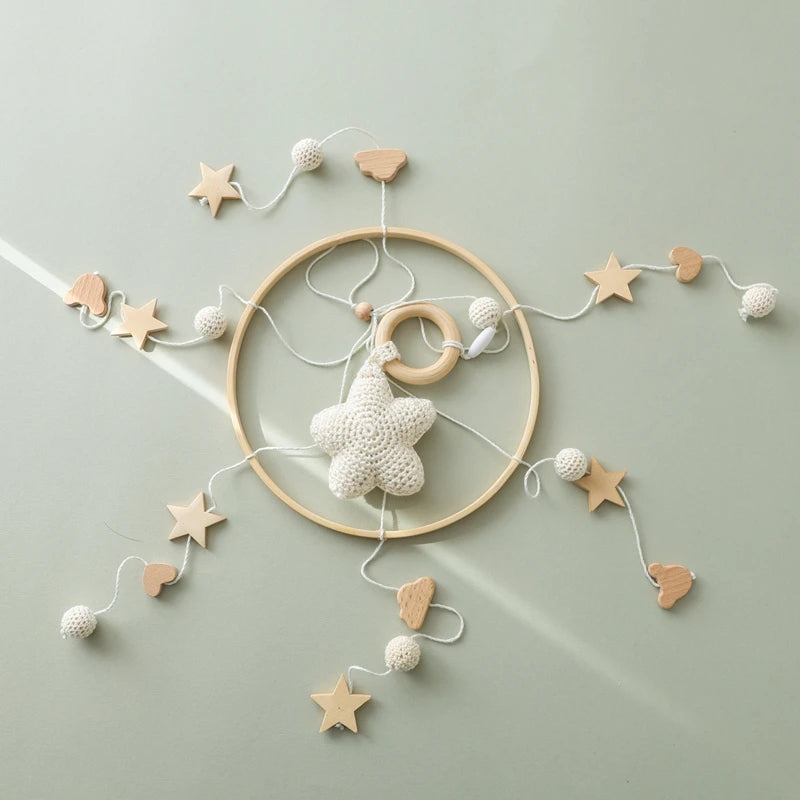 Wooden crochet stars baby crib mobile with bed bell rattle toy by Nova Mart, featuring soft crocheted stars hanging from a wooden frame.