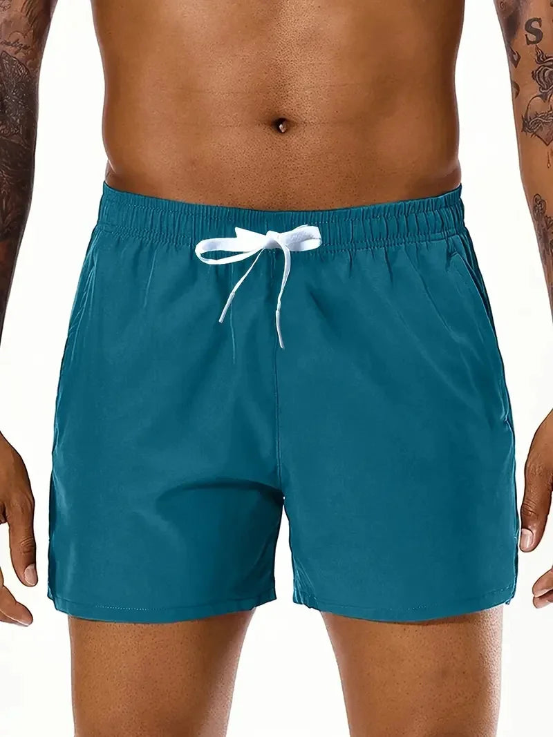 Men's beach sports shorts with elastic waist and double pocket from Nova Mart, ideal for summer beach activities.