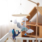 Wooden crochet star baby crib mobile with bell and rattle toy from Nova Mart, designed for infants and nursery decor.