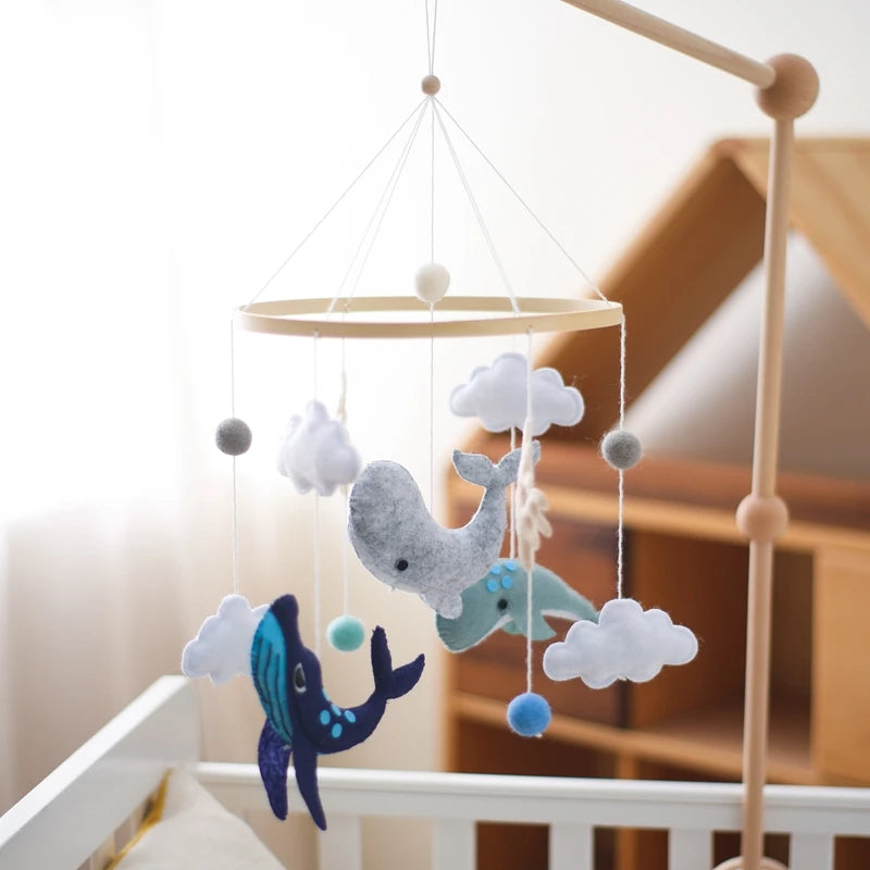 Wooden crochet star baby crib mobile with bell and rattle toy from Nova Mart, designed for infants and nursery decor.
