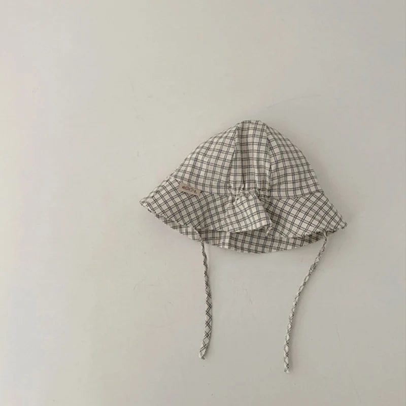 Baby bucket hat by Nova Mart, sunshade fisherman cap for infants and toddlers, featuring lightweight fabric and brim for sun protection.
