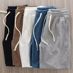 Men's casual summer shorts with waffle texture and drawstring, featuring a loose fit in navy blue from Nova Mart.