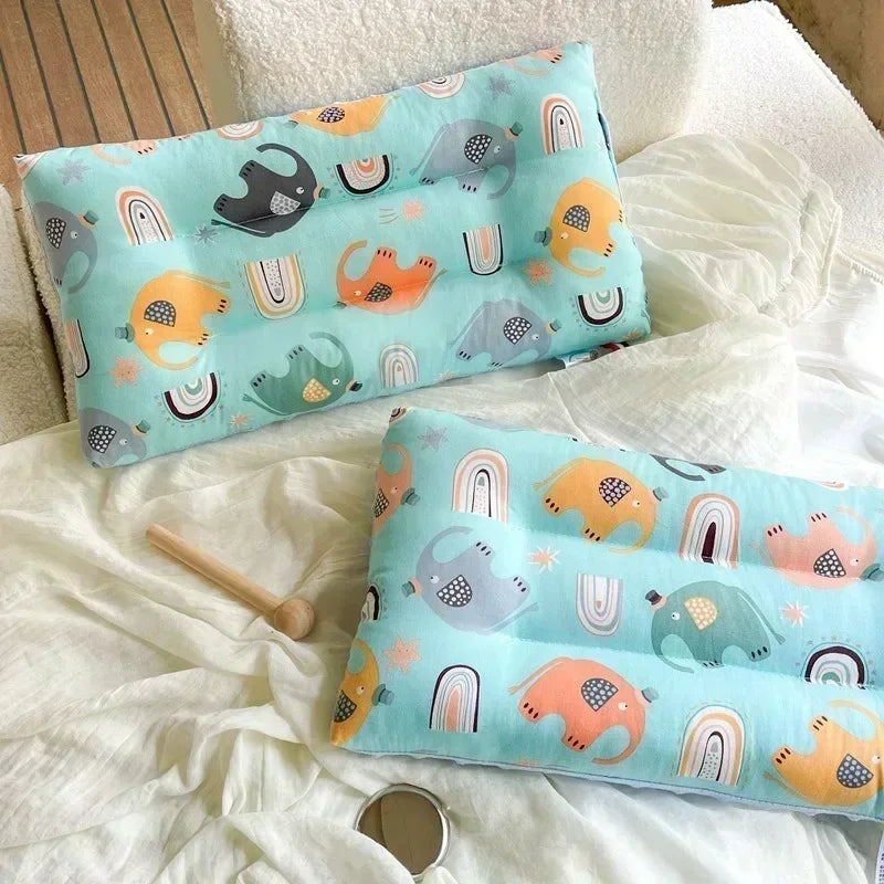 Baby sleep pillow by Nova Mart with soft cotton fabric, featuring a cute cartoon design, removable and washable for comfort and convenience.