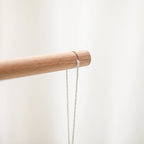 Baby wooden crib mobile with cloud-shaped hanging rattle toy and bracket, designed for soothing nursery decor.