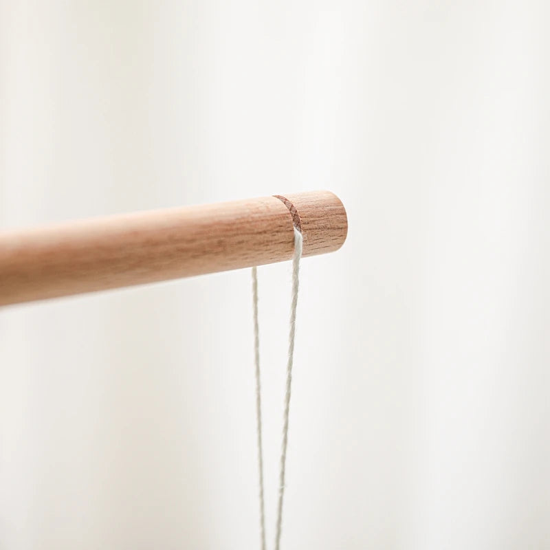 Baby wooden crib mobile with cloud-shaped hanging rattle toy and bracket, designed for soothing nursery decor.