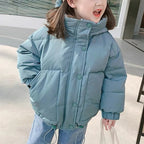 Kids wearing Nova Mart thick padded winter coat, warm kids' parka with hood, suitable for boys and girls in cold weather.