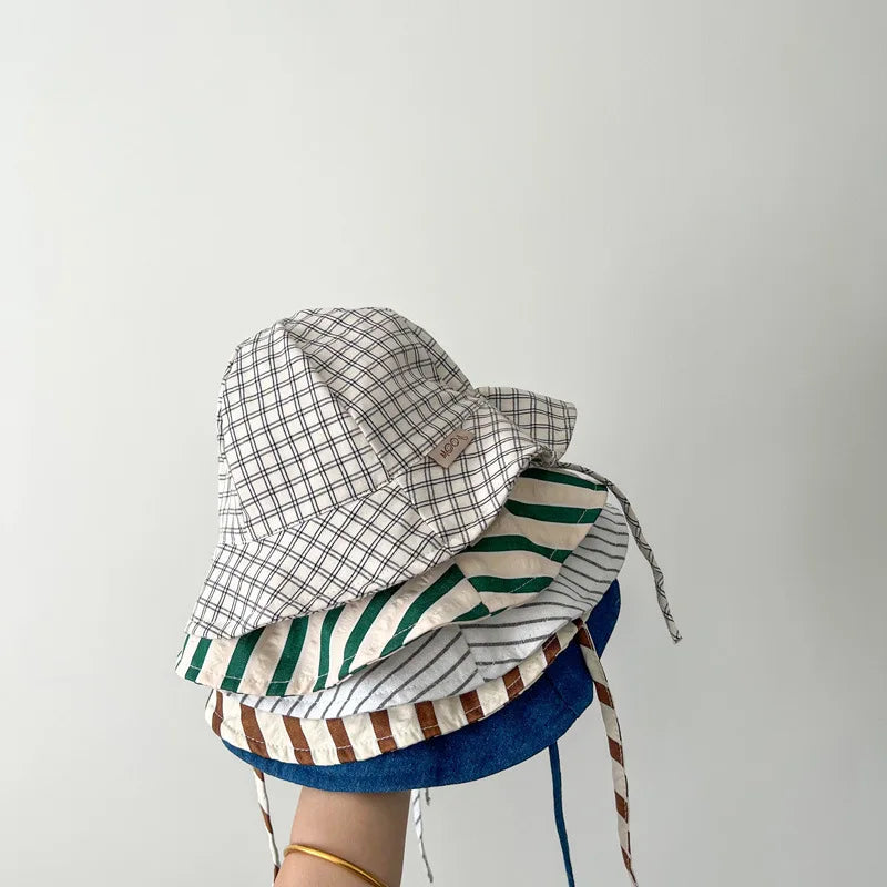 Baby bucket hat by Nova Mart with sunshade, suitable for infants and toddlers, featuring a lightweight, protective design.