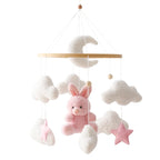 Wooden baby crib mobile by Nova Mart featuring a soft felt cartoon bear and music box for gentle nursery decoration.
