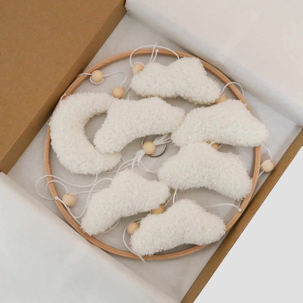 Nova Mart Boucle Clouds & Moon Baby Mobile in neutral nursery felt, featuring soft clouds and moon figures for infant's nursery decor.