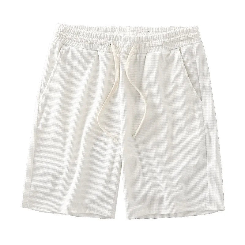Men's navy waffle texture shorts with loose fit and drawstring waist, perfect for casual summer wear by Nova Mart.