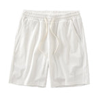Men's navy waffle texture shorts with loose fit and drawstring waist, perfect for casual summer wear by Nova Mart.