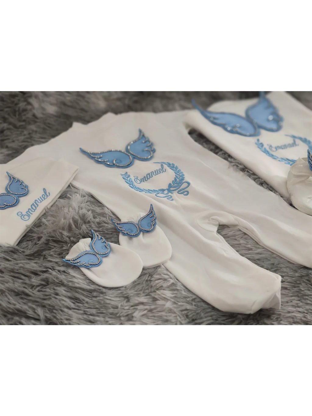 Newborn angel wings outfit set by Nova Mart, white and blue embroidered baby layette with angel wing details.