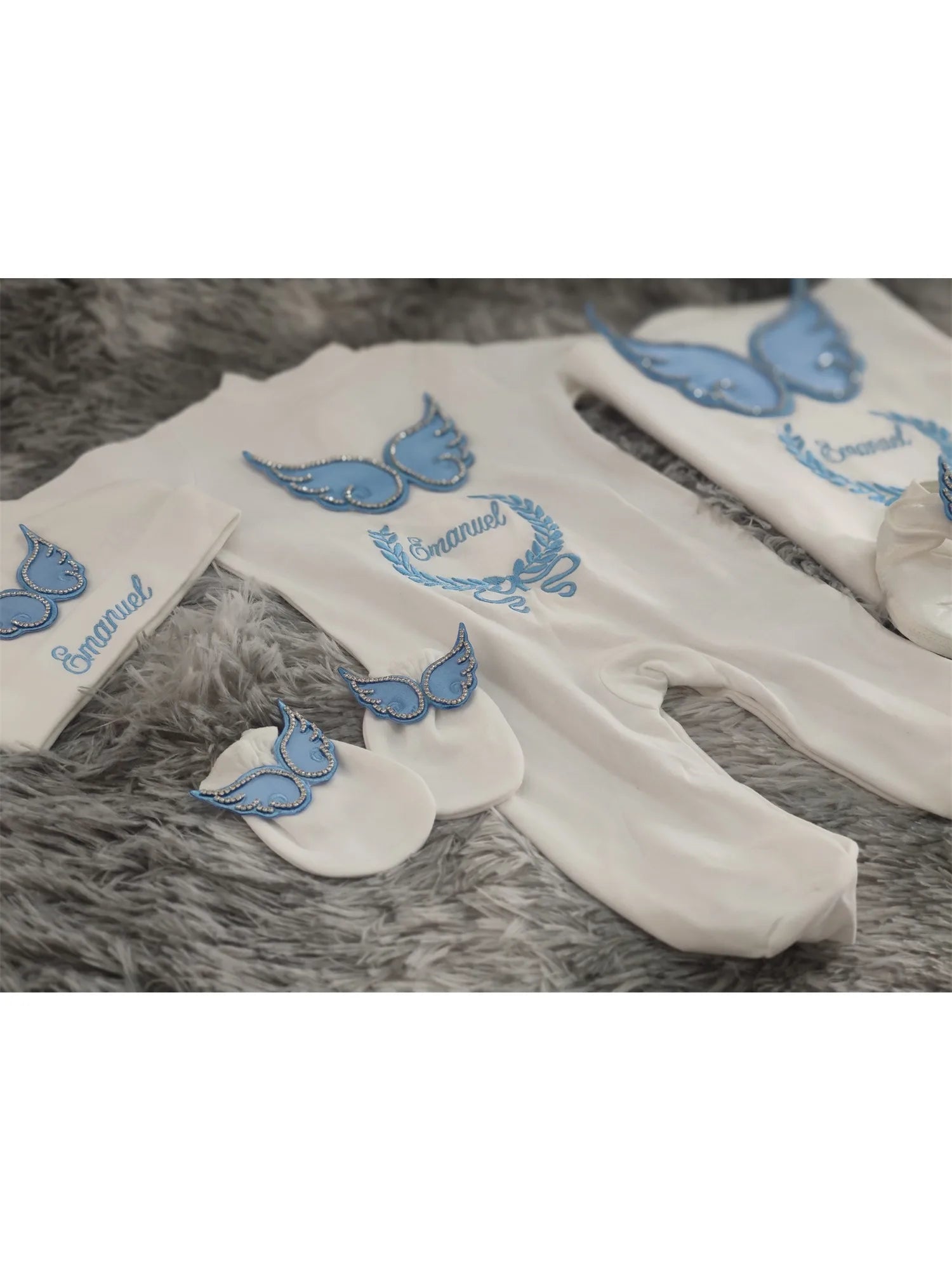 Newborn angel wings outfit set by Nova Mart, white and blue embroidered baby layette with angel wing details.