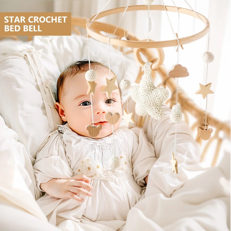 Wooden crochet stars baby crib mobile with rattle bell toy by Nova Mart, featuring soft crochet stars hanging for infant entertainment.