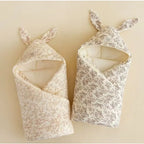 Soft cotton newborn swaddle blanket with bunny ears from Nova Mart, designed for gentle hospital wraps and baby comfort.