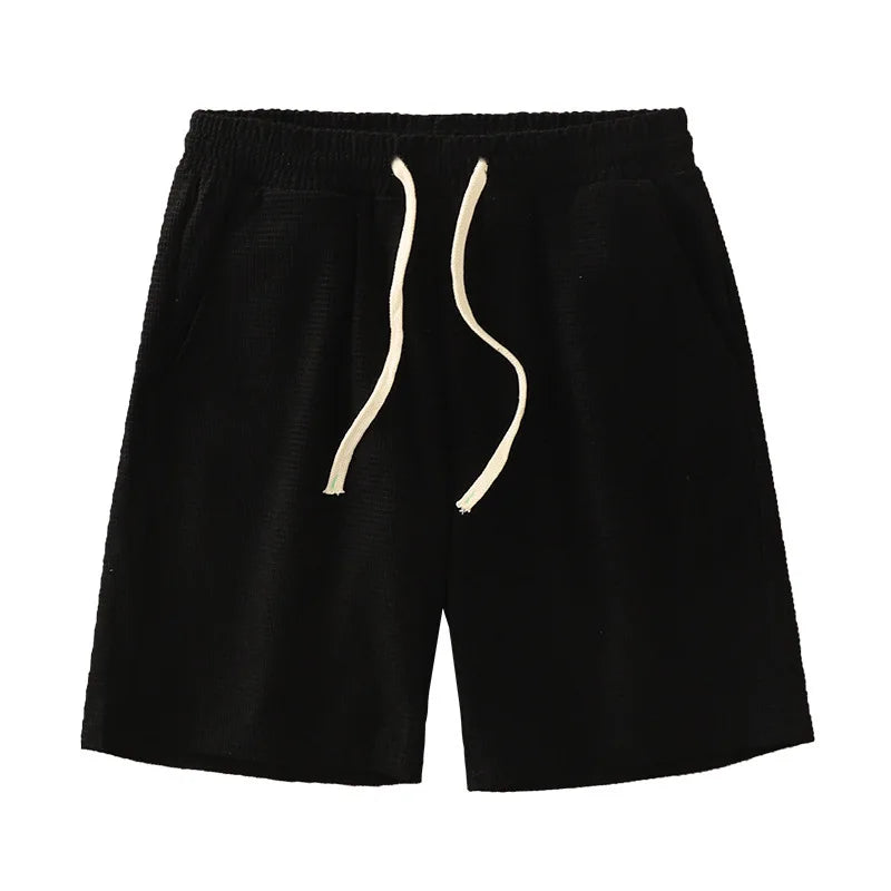 Men's navy waffle texture shorts with a loose fit and drawstring waist, perfect for casual summer wear by Nova Mart.