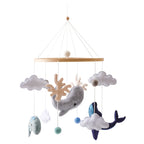 Wooden baby mobile featuring a soft felt cartoon bear and music box from Nova Mart, designed to soothe and entertain infants.
