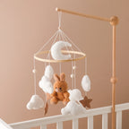 Wooden baby crib mobile by Nova Mart featuring a soft felt cartoon bear and music box for soothing nursery decor.