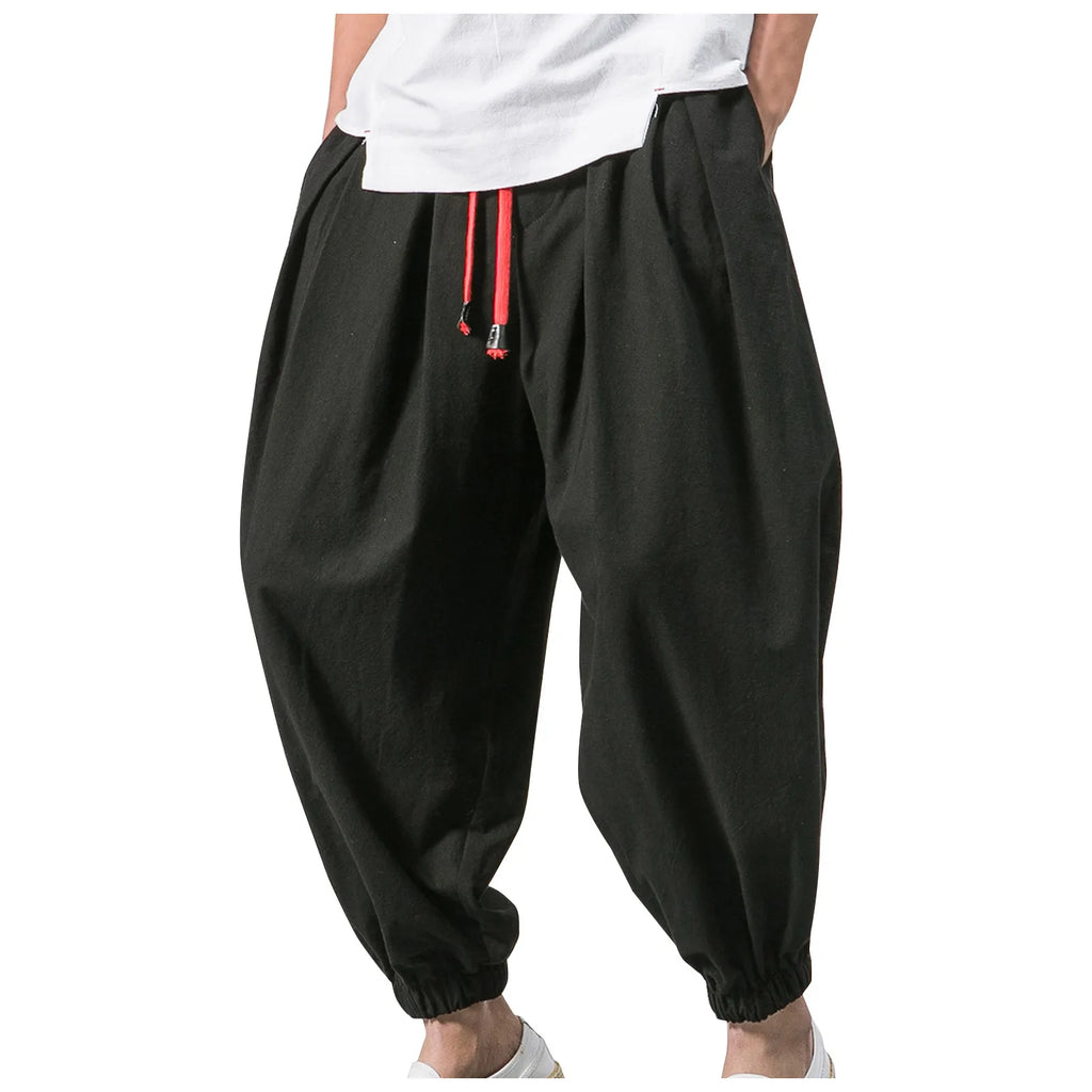 Men's loose linen harem pants by Nova Mart, featuring an oversized fit and relaxed style, displayed on a model.